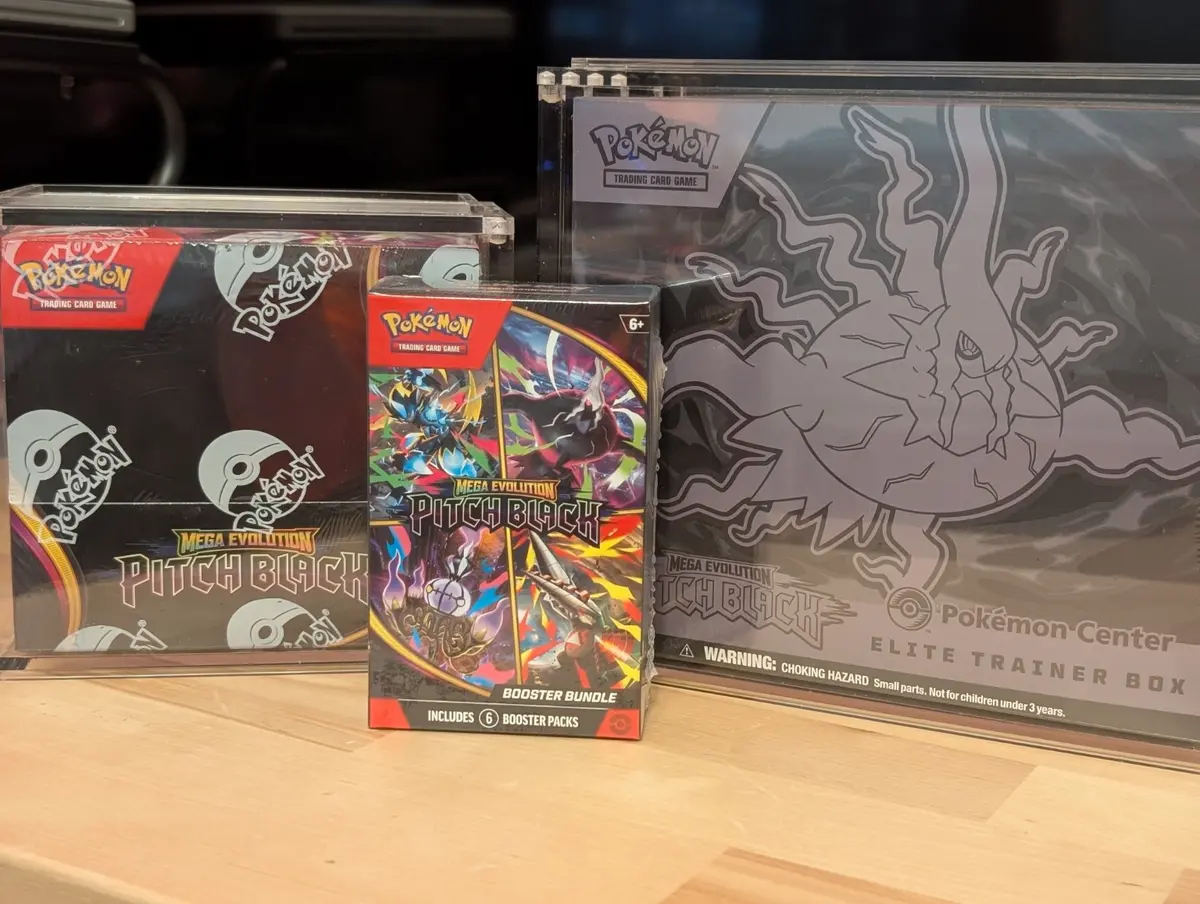 Pitch Black booster display box, booster bundle, and Pokemon Center Elite Trainer Box side by side